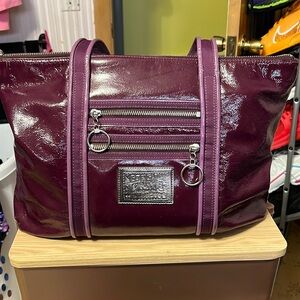 Gently used . Lg .coach bag. A few scoffs in the corner.